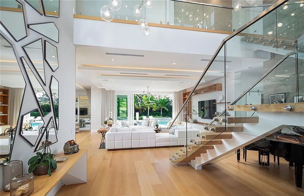 146 Myrtle Road, Naples, Florida newly completed, custom contemporary Pine Ridge estate boasts 6 beds, 10 baths, 7,238 sq ft of living space on a 1.21-acre lot.