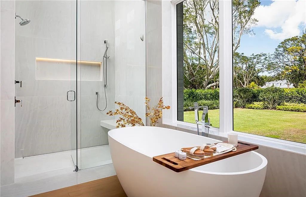 146 Myrtle Road, Naples, Florida newly completed, custom contemporary Pine Ridge estate boasts 6 beds, 10 baths, 7,238 sq ft of living space on a 1.21-acre lot.