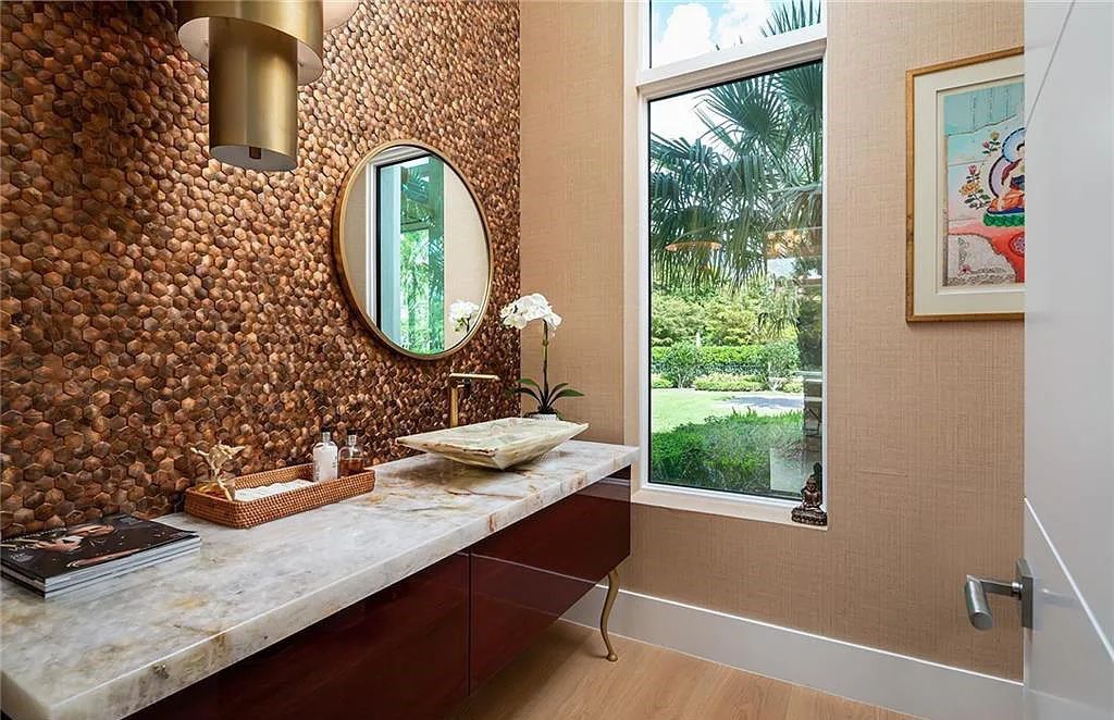 146 Myrtle Road, Naples, Florida newly completed, custom contemporary Pine Ridge estate boasts 6 beds, 10 baths, 7,238 sq ft of living space on a 1.21-acre lot.