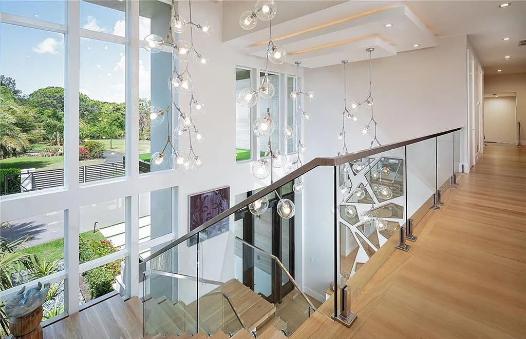 146 Myrtle Road, Naples, Florida newly completed, custom contemporary Pine Ridge estate boasts 6 beds, 10 baths, 7,238 sq ft of living space on a 1.21-acre lot.