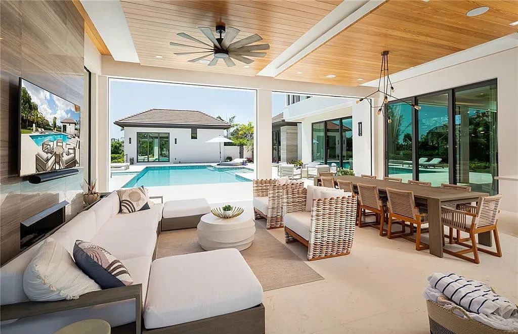 146 Myrtle Road, Naples, Florida newly completed, custom contemporary Pine Ridge estate boasts 6 beds, 10 baths, 7,238 sq ft of living space on a 1.21-acre lot.