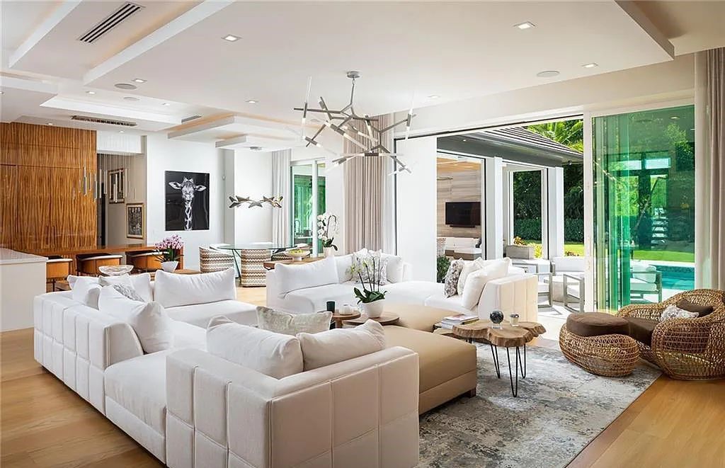 146 Myrtle Road, Naples, Florida newly completed, custom contemporary Pine Ridge estate boasts 6 beds, 10 baths, 7,238 sq ft of living space on a 1.21-acre lot.
