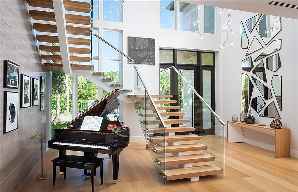 146 Myrtle Road, Naples, Florida newly completed, custom contemporary Pine Ridge estate boasts 6 beds, 10 baths, 7,238 sq ft of living space on a 1.21-acre lot.