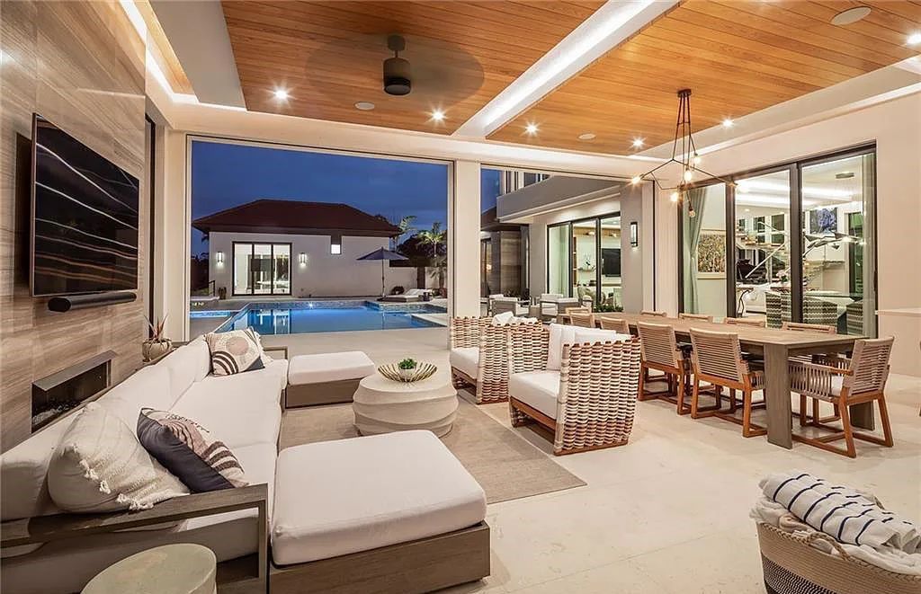 146 Myrtle Road, Naples, Florida newly completed, custom contemporary Pine Ridge estate boasts 6 beds, 10 baths, 7,238 sq ft of living space on a 1.21-acre lot.