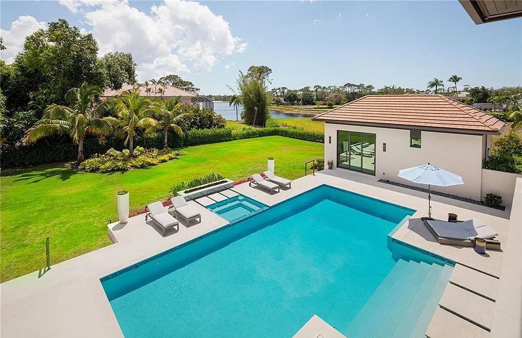 146 Myrtle Road, Naples, Florida newly completed, custom contemporary Pine Ridge estate boasts 6 beds, 10 baths, 7,238 sq ft of living space on a 1.21-acre lot.
