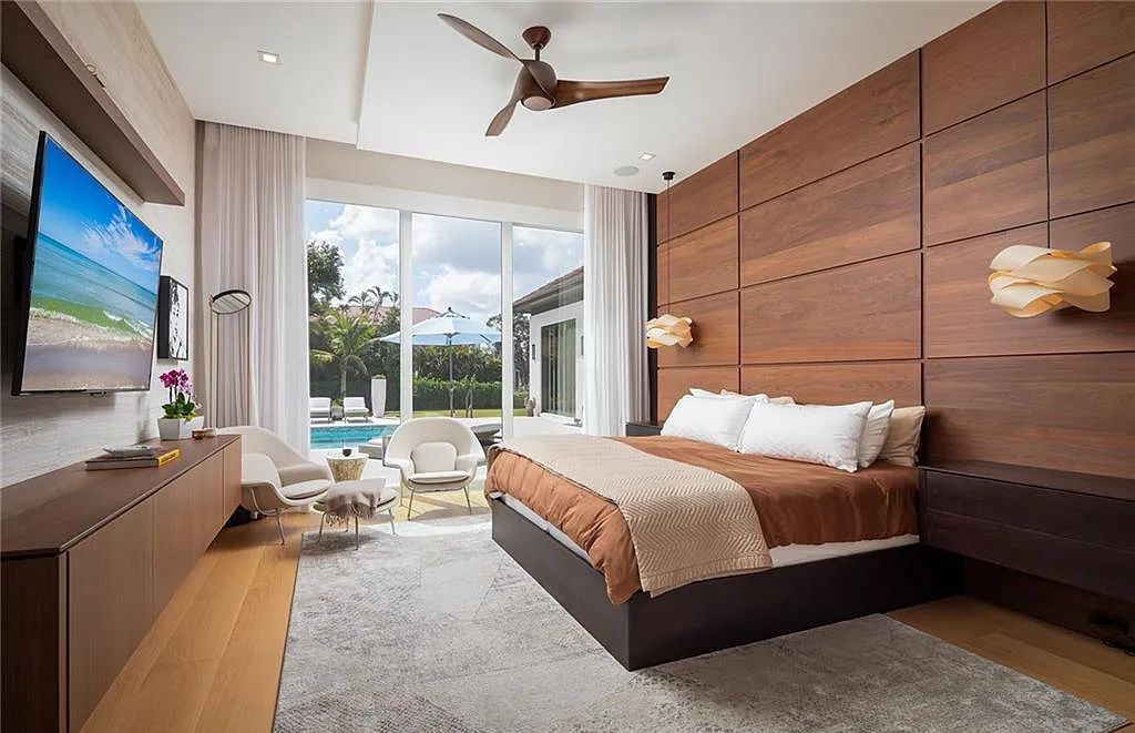 146 Myrtle Road, Naples, Florida newly completed, custom contemporary Pine Ridge estate boasts 6 beds, 10 baths, 7,238 sq ft of living space on a 1.21-acre lot.