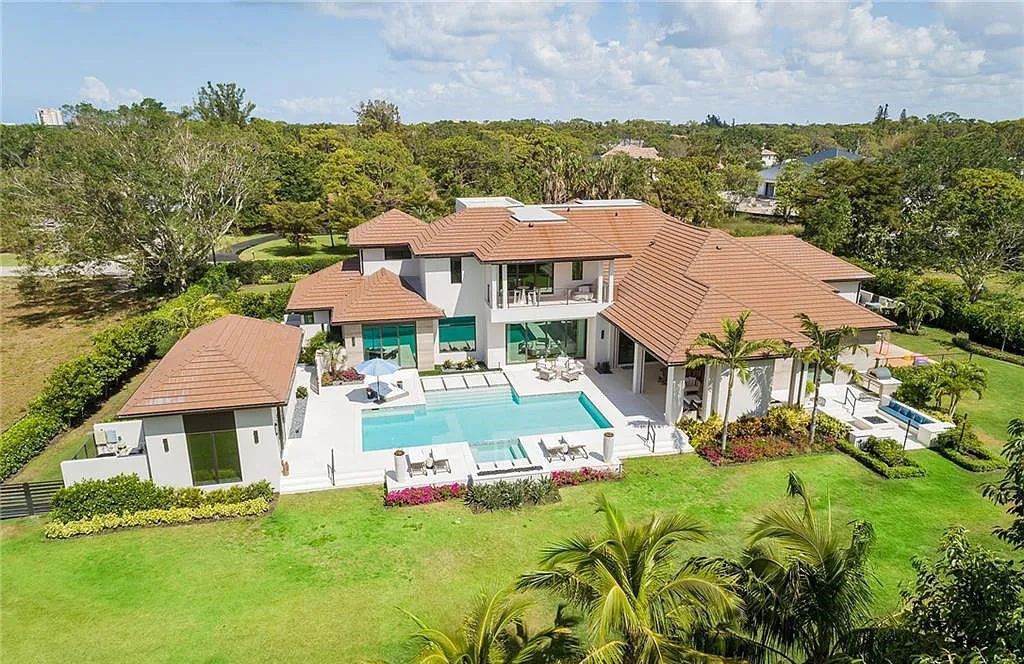 146 Myrtle Road, Naples, Florida newly completed, custom contemporary Pine Ridge estate boasts 6 beds, 10 baths, 7,238 sq ft of living space on a 1.21-acre lot.