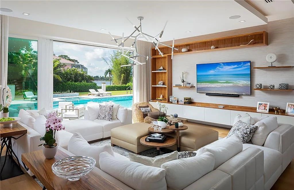 146 Myrtle Road, Naples, Florida newly completed, custom contemporary Pine Ridge estate boasts 6 beds, 10 baths, 7,238 sq ft of living space on a 1.21-acre lot.