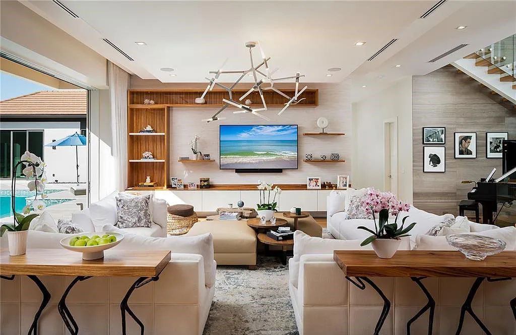 146 Myrtle Road, Naples, Florida newly completed, custom contemporary Pine Ridge estate boasts 6 beds, 10 baths, 7,238 sq ft of living space on a 1.21-acre lot.