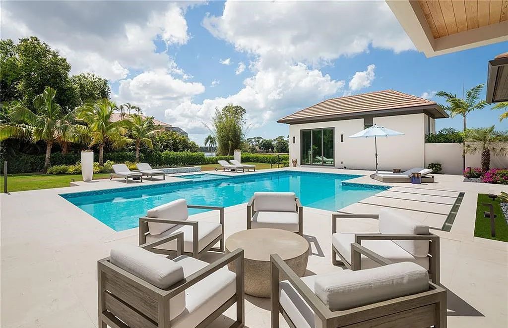 146 Myrtle Road, Naples, Florida newly completed, custom contemporary Pine Ridge estate boasts 6 beds, 10 baths, 7,238 sq ft of living space on a 1.21-acre lot.