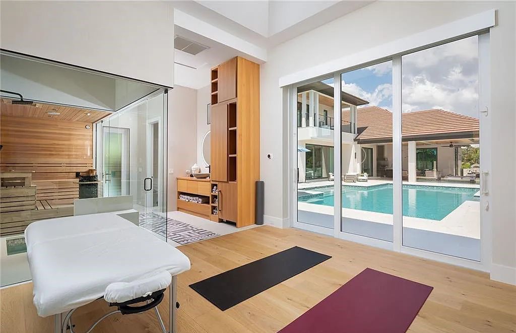 146 Myrtle Road, Naples, Florida newly completed, custom contemporary Pine Ridge estate boasts 6 beds, 10 baths, 7,238 sq ft of living space on a 1.21-acre lot.
