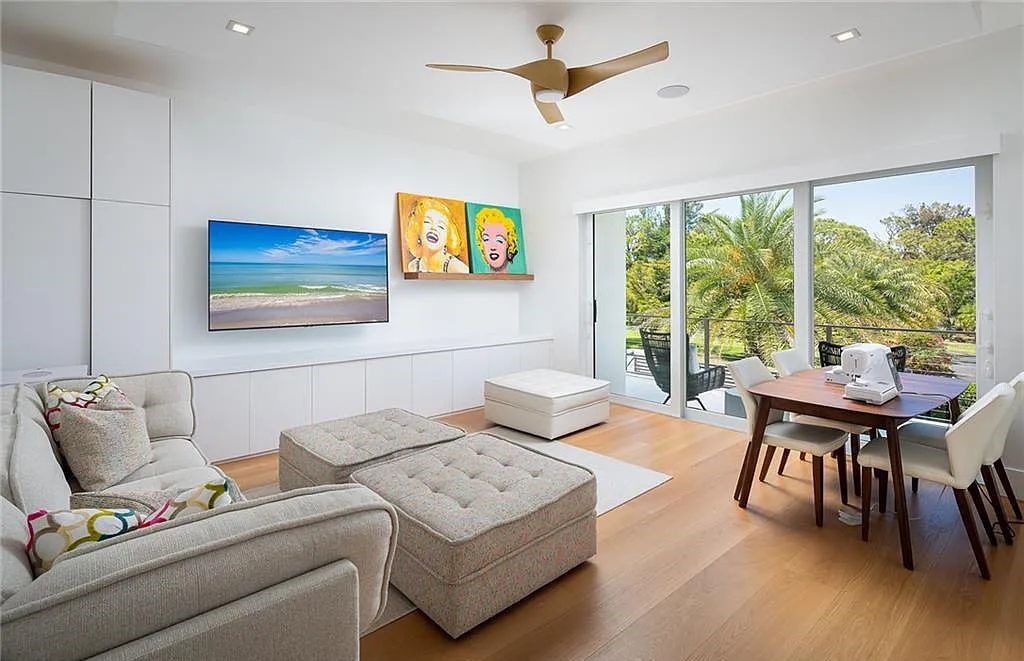146 Myrtle Road, Naples, Florida newly completed, custom contemporary Pine Ridge estate boasts 6 beds, 10 baths, 7,238 sq ft of living space on a 1.21-acre lot.