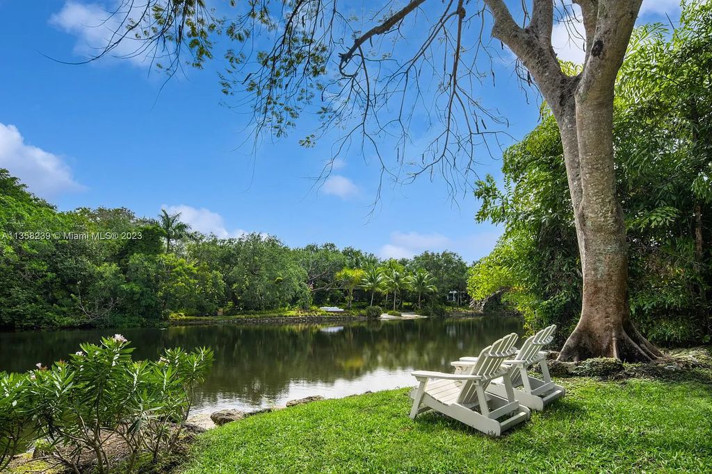 Experience unparalleled luxury in this lakefront estate located at 10201 Sabal Palm Avenue, Coral Gables, Florida. With 5 bedrooms, 7 bathrooms, and 2 half-bathrooms, this sprawling 9,266 sq ft home boasts an infinity saltwater pool, custom-designed kitchen, and floor-to-ceiling windows.