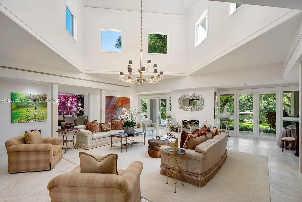 Experience unparalleled luxury in this lakefront estate located at 10201 Sabal Palm Avenue, Coral Gables, Florida. With 5 bedrooms, 7 bathrooms, and 2 half-bathrooms, this sprawling 9,266 sq ft home boasts an infinity saltwater pool, custom-designed kitchen, and floor-to-ceiling windows.