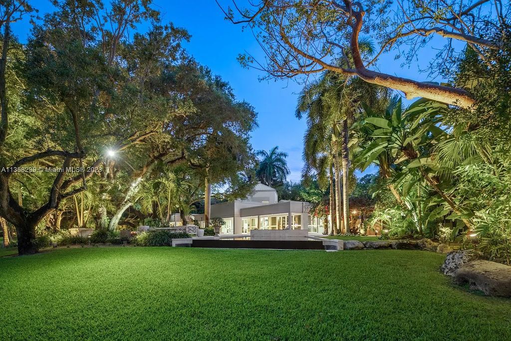 Experience unparalleled luxury in this lakefront estate located at 10201 Sabal Palm Avenue, Coral Gables, Florida. With 5 bedrooms, 7 bathrooms, and 2 half-bathrooms, this sprawling 9,266 sq ft home boasts an infinity saltwater pool, custom-designed kitchen, and floor-to-ceiling windows.