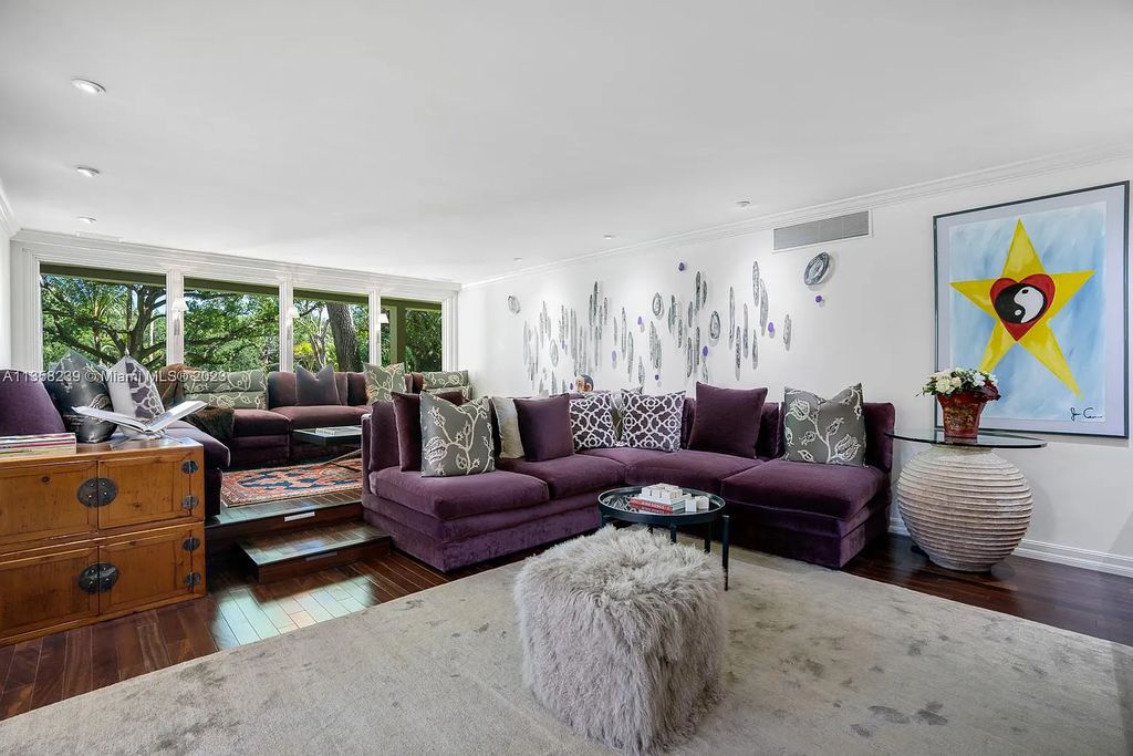Experience unparalleled luxury in this lakefront estate located at 10201 Sabal Palm Avenue, Coral Gables, Florida. With 5 bedrooms, 7 bathrooms, and 2 half-bathrooms, this sprawling 9,266 sq ft home boasts an infinity saltwater pool, custom-designed kitchen, and floor-to-ceiling windows.