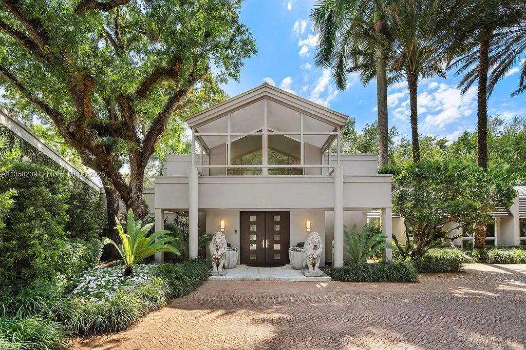 Experience unparalleled luxury in this lakefront estate located at 10201 Sabal Palm Avenue, Coral Gables, Florida. With 5 bedrooms, 7 bathrooms, and 2 half-bathrooms, this sprawling 9,266 sq ft home boasts an infinity saltwater pool, custom-designed kitchen, and floor-to-ceiling windows.
