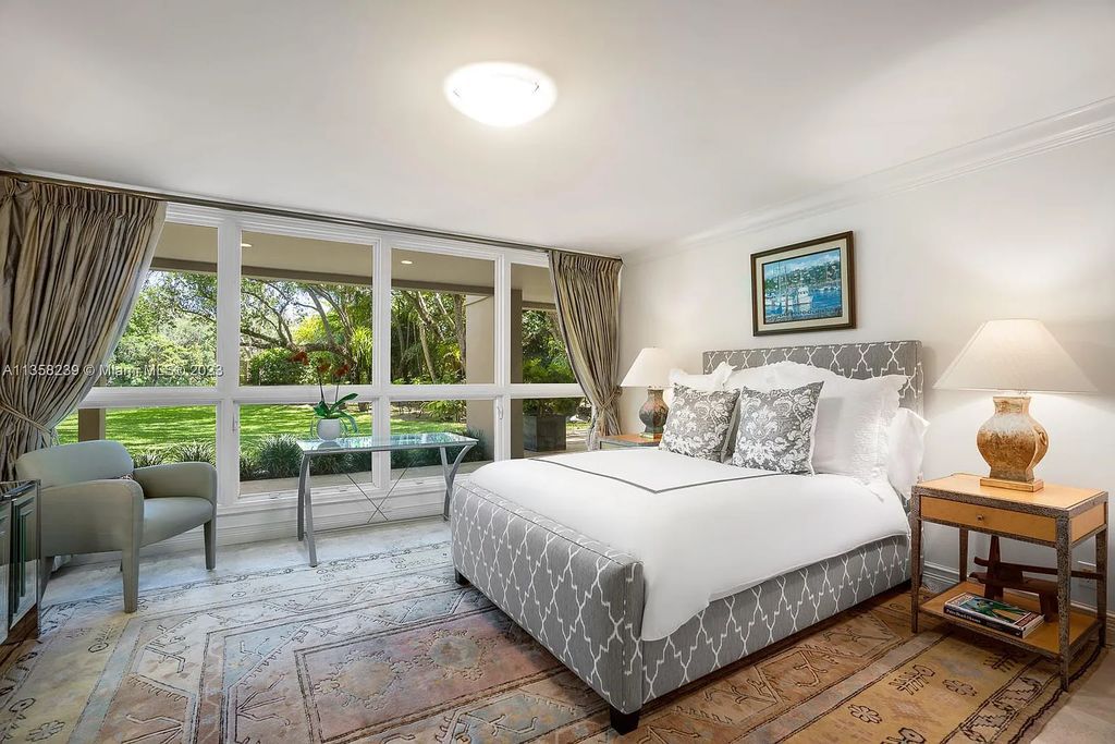 Experience unparalleled luxury in this lakefront estate located at 10201 Sabal Palm Avenue, Coral Gables, Florida. With 5 bedrooms, 7 bathrooms, and 2 half-bathrooms, this sprawling 9,266 sq ft home boasts an infinity saltwater pool, custom-designed kitchen, and floor-to-ceiling windows.