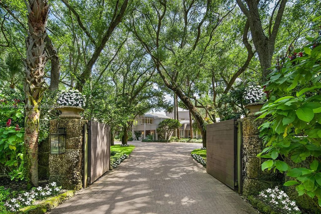 Experience unparalleled luxury in this lakefront estate located at 10201 Sabal Palm Avenue, Coral Gables, Florida. With 5 bedrooms, 7 bathrooms, and 2 half-bathrooms, this sprawling 9,266 sq ft home boasts an infinity saltwater pool, custom-designed kitchen, and floor-to-ceiling windows.