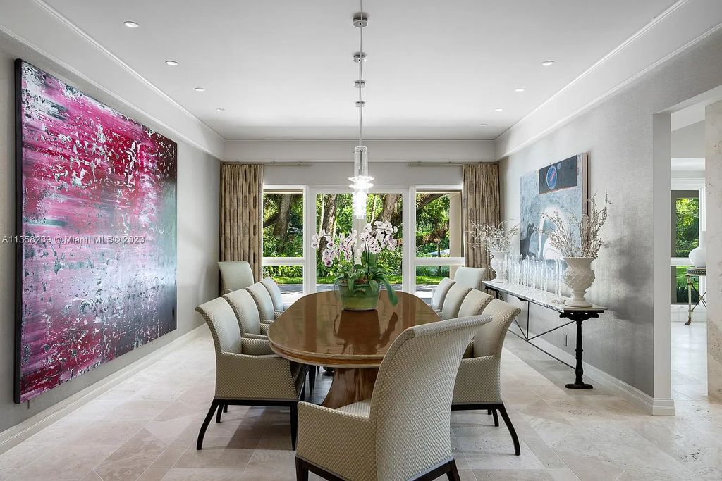 Experience unparalleled luxury in this lakefront estate located at 10201 Sabal Palm Avenue, Coral Gables, Florida. With 5 bedrooms, 7 bathrooms, and 2 half-bathrooms, this sprawling 9,266 sq ft home boasts an infinity saltwater pool, custom-designed kitchen, and floor-to-ceiling windows.