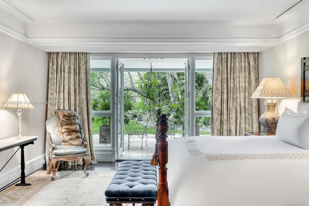 Experience unparalleled luxury in this lakefront estate located at 10201 Sabal Palm Avenue, Coral Gables, Florida. With 5 bedrooms, 7 bathrooms, and 2 half-bathrooms, this sprawling 9,266 sq ft home boasts an infinity saltwater pool, custom-designed kitchen, and floor-to-ceiling windows.