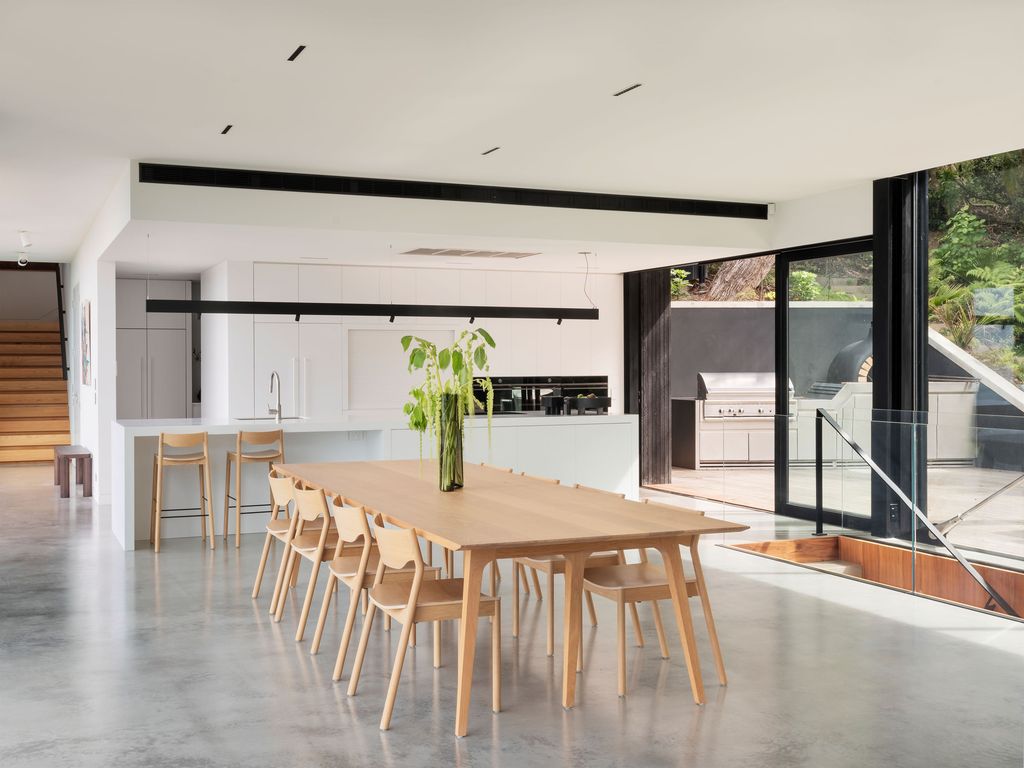 Mahuika House with spaces extend over the pool below by Daniel Marshall