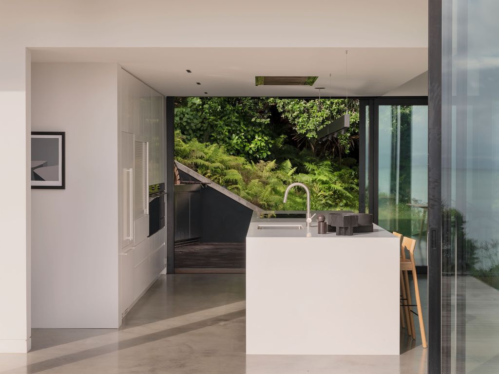 Mahuika House with spaces extend over the pool below by Daniel Marshall