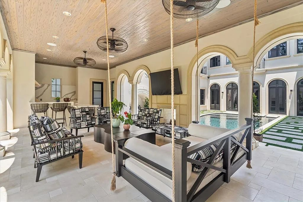 Live in luxury at the Four Seasons Private Residences 10242 Summer Meadow Way in Golden Oak, Orlando, Florida.