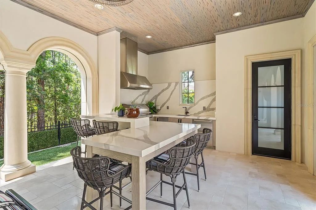 Live in luxury at the Four Seasons Private Residences 10242 Summer Meadow Way in Golden Oak, Orlando, Florida.