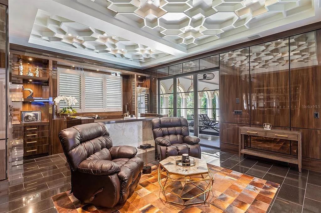 Live in luxury at the Four Seasons Private Residences 10242 Summer Meadow Way in Golden Oak, Orlando, Florida.