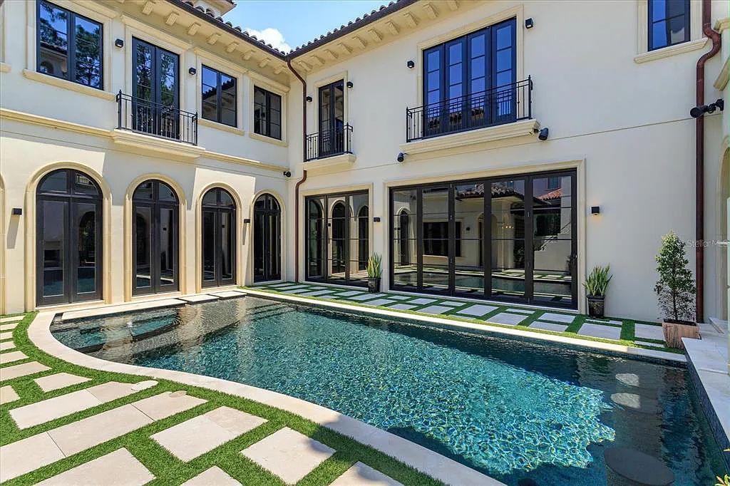 Live in luxury at the Four Seasons Private Residences 10242 Summer Meadow Way in Golden Oak, Orlando, Florida.