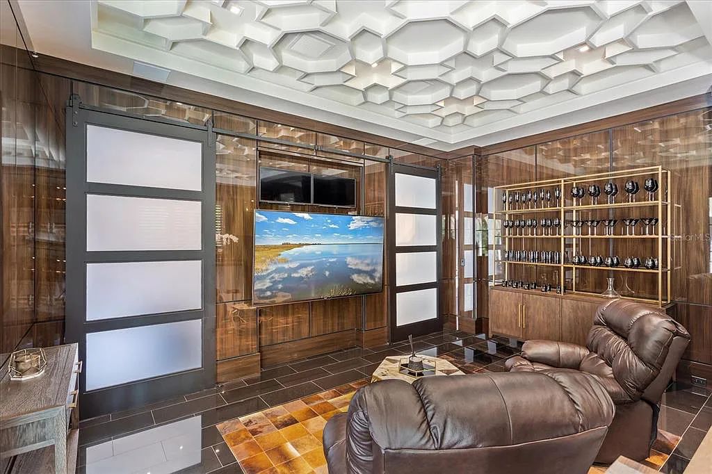 Live in luxury at the Four Seasons Private Residences 10242 Summer Meadow Way in Golden Oak, Orlando, Florida.