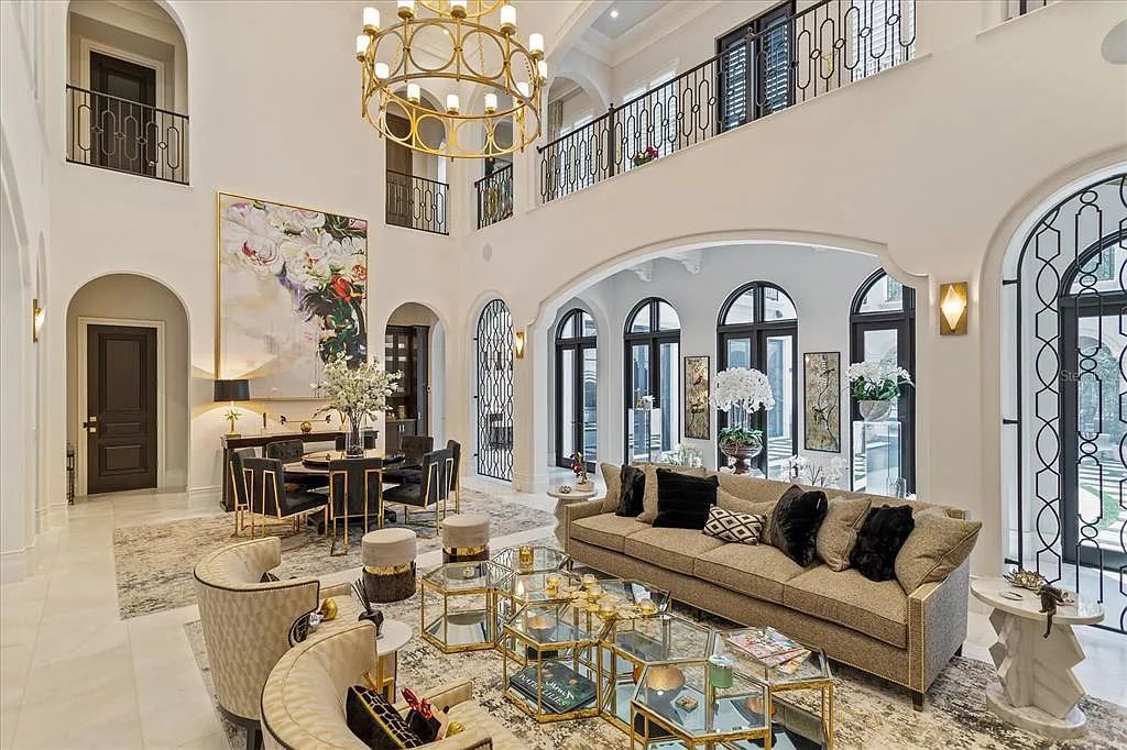Live in luxury at the Four Seasons Private Residences 10242 Summer Meadow Way in Golden Oak, Orlando, Florida.