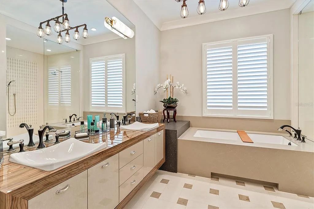 Live in luxury at the Four Seasons Private Residences 10242 Summer Meadow Way in Golden Oak, Orlando, Florida.