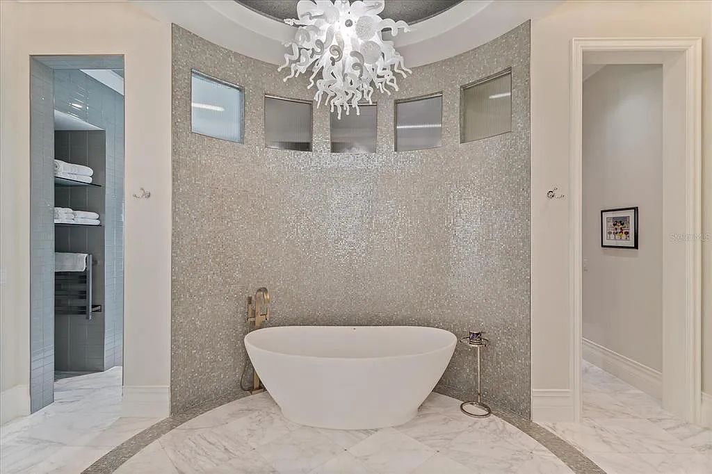 Live in luxury at the Four Seasons Private Residences 10242 Summer Meadow Way in Golden Oak, Orlando, Florida.