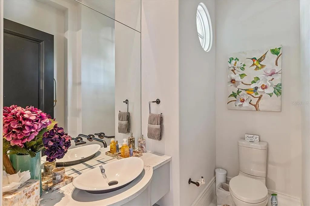 Live in luxury at the Four Seasons Private Residences 10242 Summer Meadow Way in Golden Oak, Orlando, Florida.