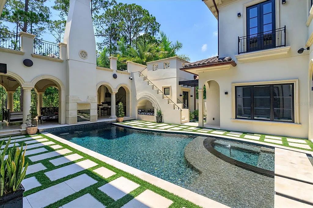 Live in luxury at the Four Seasons Private Residences 10242 Summer Meadow Way in Golden Oak, Orlando, Florida.