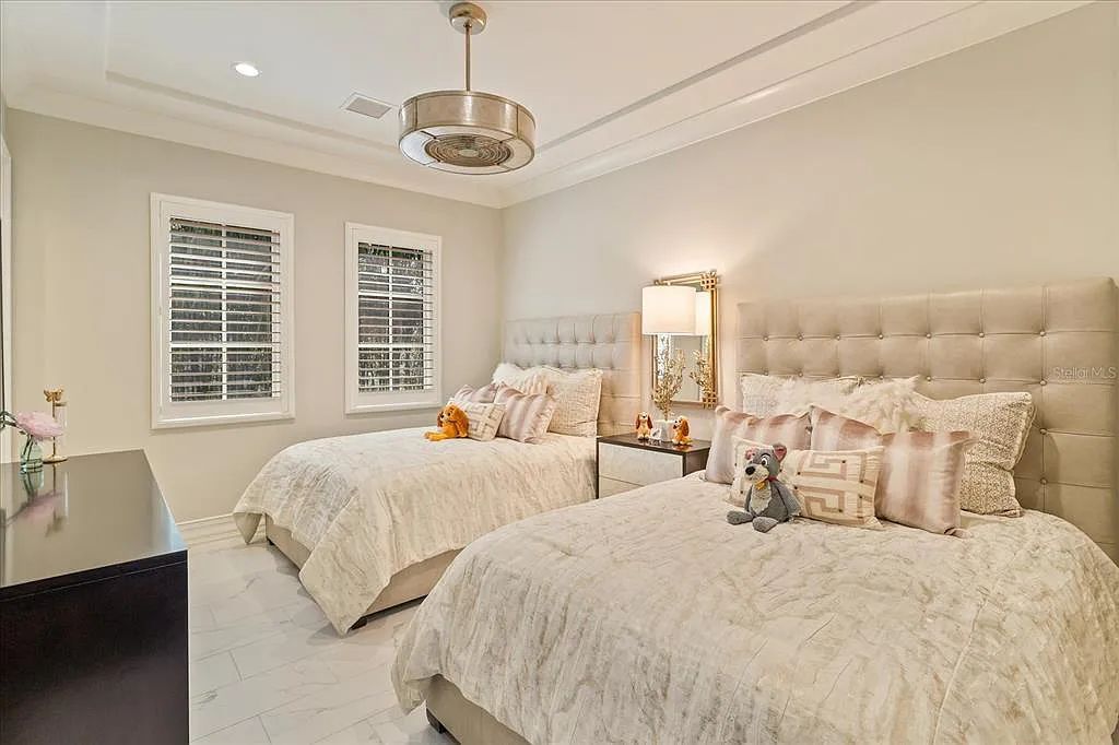 Live in luxury at the Four Seasons Private Residences 10242 Summer Meadow Way in Golden Oak, Orlando, Florida.