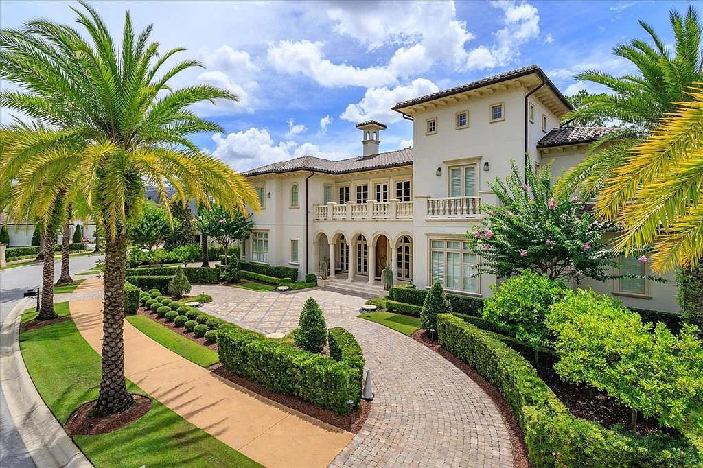 Live in luxury at the Four Seasons Private Residences 10242 Summer Meadow Way in Golden Oak, Orlando, Florida.