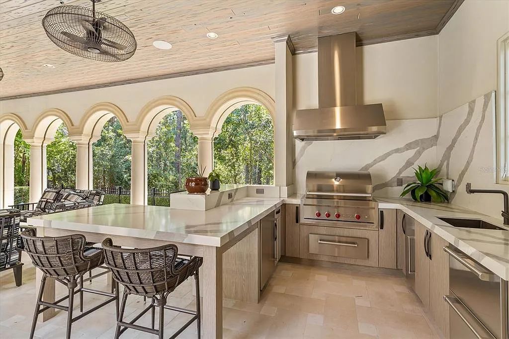 Live in luxury at the Four Seasons Private Residences 10242 Summer Meadow Way in Golden Oak, Orlando, Florida.