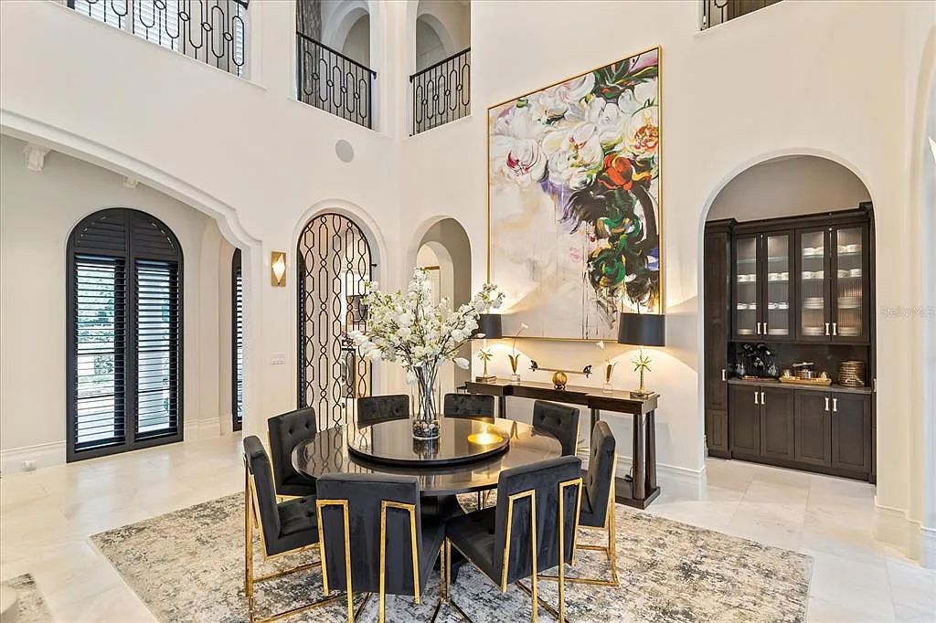 Live in luxury at the Four Seasons Private Residences 10242 Summer Meadow Way in Golden Oak, Orlando, Florida.