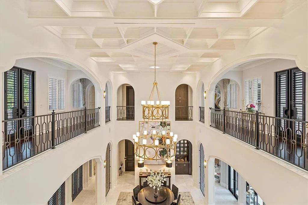Live in luxury at the Four Seasons Private Residences 10242 Summer Meadow Way in Golden Oak, Orlando, Florida.