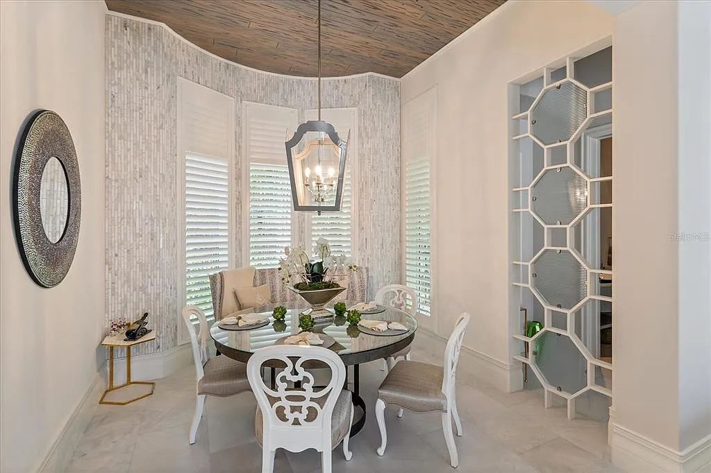 Live in luxury at the Four Seasons Private Residences 10242 Summer Meadow Way in Golden Oak, Orlando, Florida.