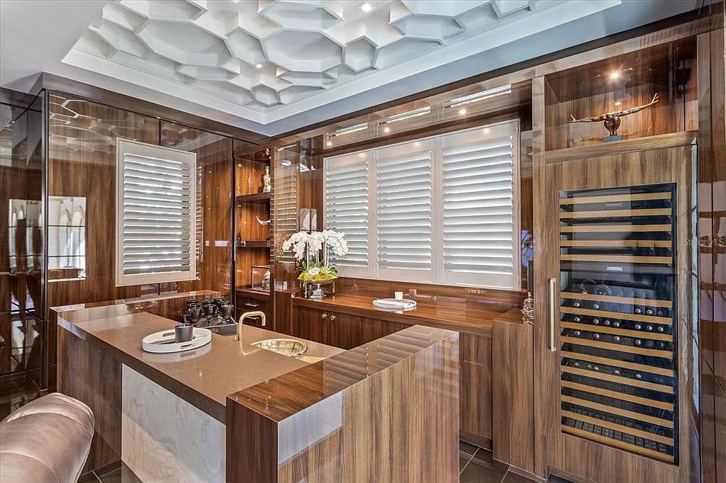 Live in luxury at the Four Seasons Private Residences 10242 Summer Meadow Way in Golden Oak, Orlando, Florida.