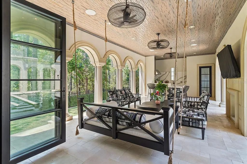 Live in luxury at the Four Seasons Private Residences 10242 Summer Meadow Way in Golden Oak, Orlando, Florida.