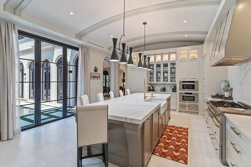 Live in luxury at the Four Seasons Private Residences 10242 Summer Meadow Way in Golden Oak, Orlando, Florida.