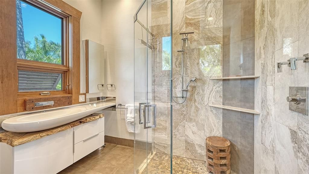 Experience luxury waterfront living at its finest with this stunning custom estate in 10216 46th Avenue W, Bradenton, Florida.