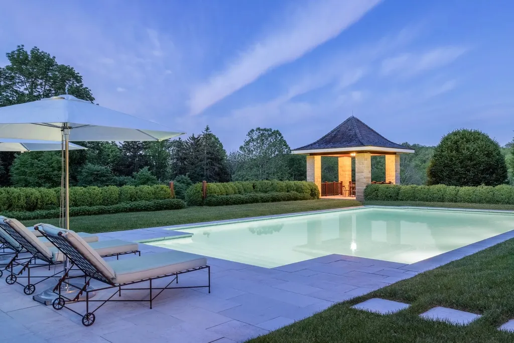 0 Meetinghouse Road, New Hope, Pennsylvania. Meticulously crafted by renowned professionals, this extraordinary estate is nestled in a coveted location off one of Bucks County's most desirable roads. Spanning 44 acres of serene privacy, the residence embodies timeless elegance and meticulous attention to detail. Designed by acclaimed architect Allan Greenberg and featuring the impeccable landscape work of Barbara Paca, this bespoke home seamlessly blends classical elements with modern sophistication.