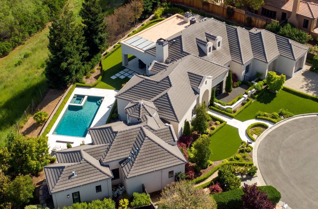 10450 Serra Street Home in Cupertino, California. A Private Silicon Valley Haven - This exceptional estate is tucked away in a tranquil cul-de-sac, providing a serene retreat within close proximity to the vibrant Silicon Valley. Surrounded by the natural beauty of Rancho San Antonio Preserve, this stunning home offers hiking and biking trails and breathtaking views. 