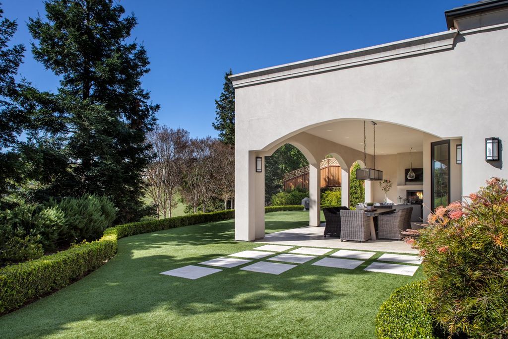10450 Serra Street Home in Cupertino, California. A Private Silicon Valley Haven - This exceptional estate is tucked away in a tranquil cul-de-sac, providing a serene retreat within close proximity to the vibrant Silicon Valley. Surrounded by the natural beauty of Rancho San Antonio Preserve, this stunning home offers hiking and biking trails and breathtaking views. 